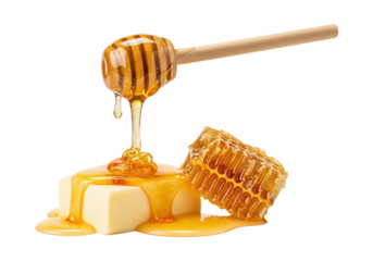Golden honey poured from a dipper onto butter cubes next to honeycomb, isolated on transparent background