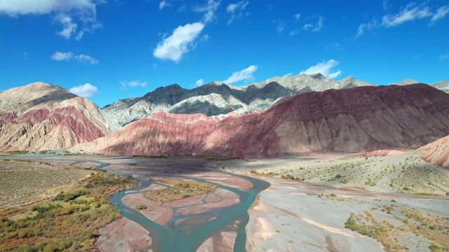 Drone view of Yadan landform near Kashgar in southern Xinjiang, China. High angle view of colorful mountains in sunny autumn day, 4k real time landscape footage b roll shot.