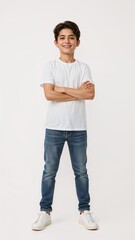 Full length of confident Jordanian boy smiling in a casual outfit in a white tshirt and jeans standing with his arm and leg crossed on plain white background