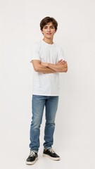 Full length of confident Polish boy smiling in a casual outfit in a white tshirt and jeans standing with his arm and leg crossed on plain white background