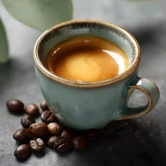  A steaming cup of espresso with roasted coffee beans © Siriroj