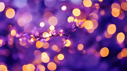 Delicate blossoming branch with dreamy purple bokeh background.