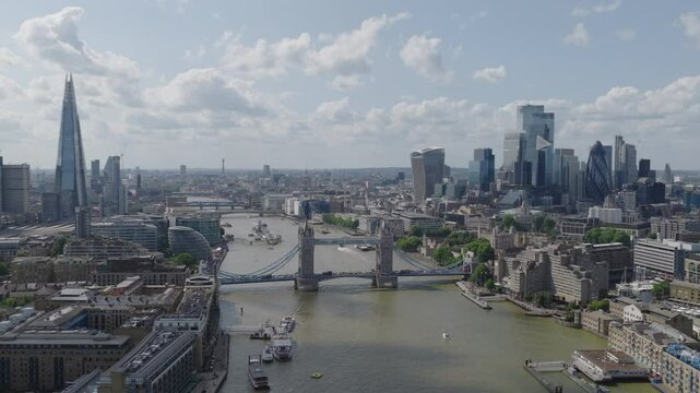 Aerial establishing shot of London skyline with Tower Bridge, City of London and the Shard during the day time.