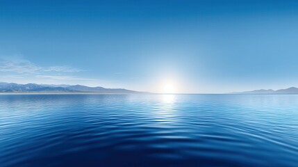 Obraz premium Serene blue ocean with gentle waves and a distant mountain landscape.