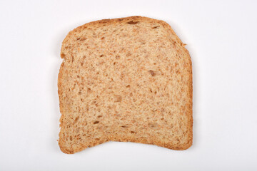 A single slice of whole wheat bread on a white background