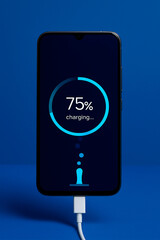 the smartphone is charging and the phone screen is charging, on a blue background