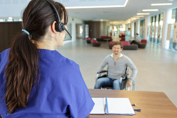 man in wheelchair in reception area