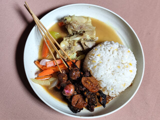 Goulash satay. Sate gulai is a traditional Indonesian culinary menu, curry satay cooked using...