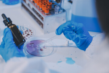 Research, experiment and medical trial being done by a scientist in a lab, science facility or...