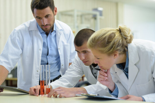group of students in the lab - Powered by Adobe