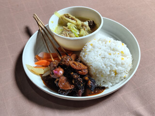 Goulash satay. Sate gulai is a traditional Indonesian culinary menu, curry satay cooked using spices.