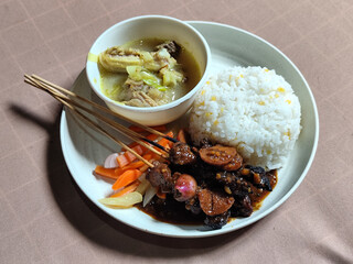 Goulash satay. Sate gulai is a traditional Indonesian culinary menu, curry satay cooked using spices.