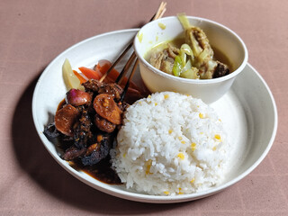 Goulash satay. Sate gulai is a traditional Indonesian culinary menu, curry satay cooked using...