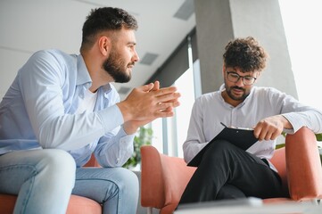 Psychologist listening to patient talking about problems during therapy session