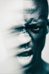 A man's face is blurred and his eyes are open wide