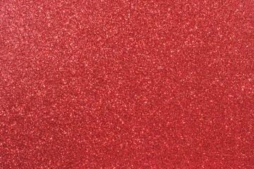 A red background with a lot of glitter