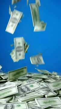 Cascading dollar bills against blue sky  money rainfall and wealth concept
