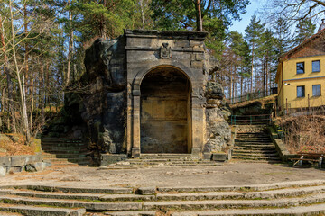 Historical stone amphitheater entrance in forest setting