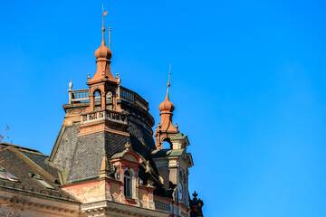 Victorian architecture with turrets under clear blue sky