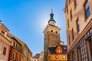 Historic clock tower with clear blue sky in european urban setting