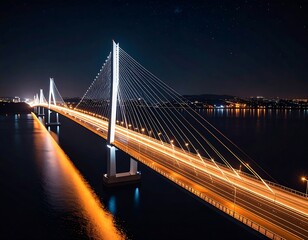 Fototapeta premium Illuminated bridge at night over water