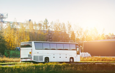 Rural highway with a modern white bus
