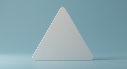 Fototapeta premium A white triangle with rounded corners stands against a light blue background, casting a soft shadow.