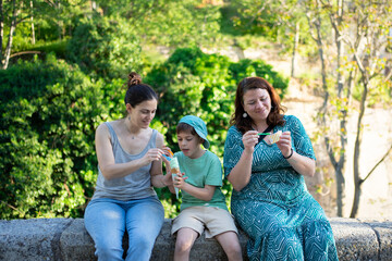 Family enjoying ice cream and snacks in park