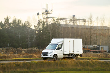 Cargo vehicle traveling countryside area