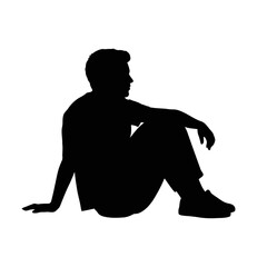 Man sitting with his legs crossed, silhouette of contemplation