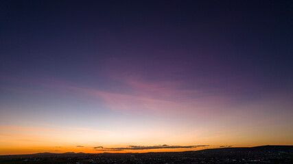 Fototapeta premium Sunset sky after sundown aerial view