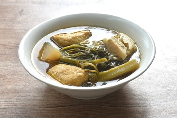 boiled braised mixed vegetable with tofu in Chinese herb stew soup on bowl 