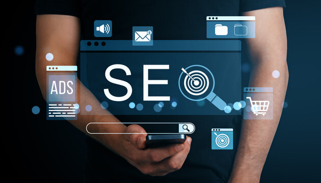 SEO technology concept with digital marketing icons and person holding smartphone on dark abstract background for ecommerce and business strategy. - Powered by Adobe