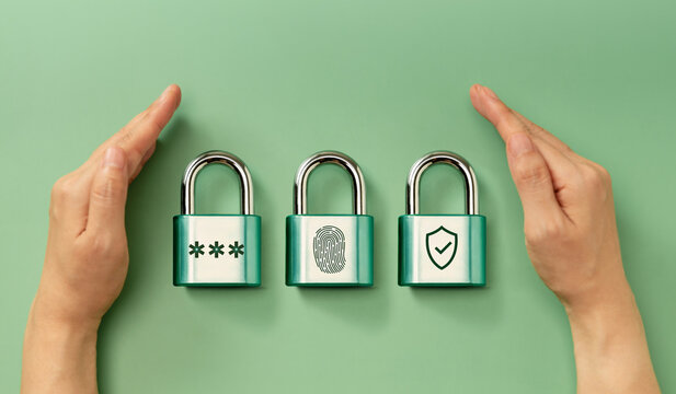 Cybersecurity Conceptual image. Hands securing padlocks representing password, fingerprint, and shield for digital authentication and multi-layered security