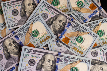 One hundred dollars pile as background. Dollars Closeup Concept. American Dollars Cash Money. One...