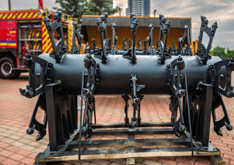 Demining machine rotor with spiked flails, designed for clearing landmines with durable engineering.