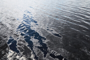 Serene Blue and Silver Rippling Water Surface in Natural Light