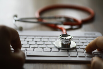 Stethoscope on Keyboard Indicating Modern Healthcare Technology and Digital Medical Solutions