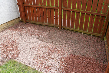 Red chip stones laid on garden border