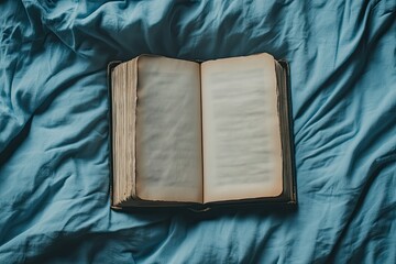 High Definition Picture of Overhead View of Open Book on Bed