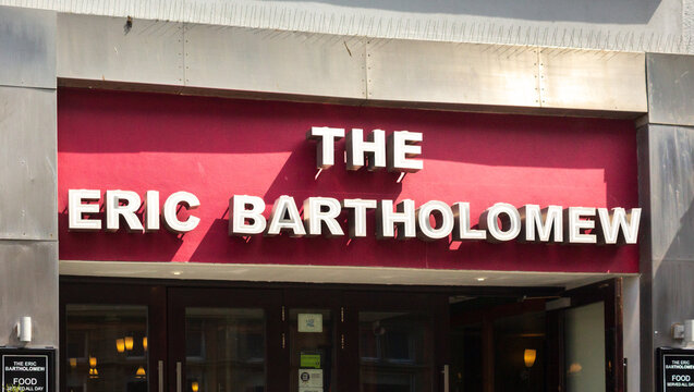 Sign over the entrance to Wetherspoons pub in popular comedian Eric Morecambe's home town which has been given his real name Eric Bartholomew