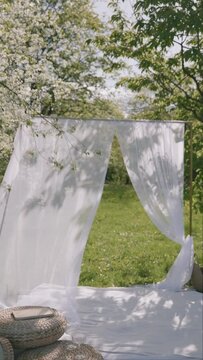 outdoor space features white curtains swaying