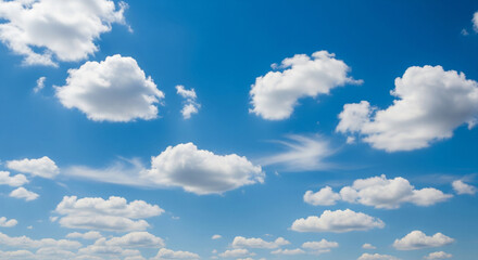 Fototapeta premium Natural blue sky with soft white clouds in daylight, featuring authentic cloud formations and clean atmosphere, ideal for backgrounds, weather visuals, or serene outdoor scenes