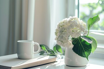 high definition view of White mug mockup with a book and a hortensia in a pot on a white table