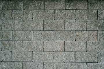 Textured Concrete Wall with Regular Pattern of Light Gray Blocks Suitable for Various Design and Architectural Applications