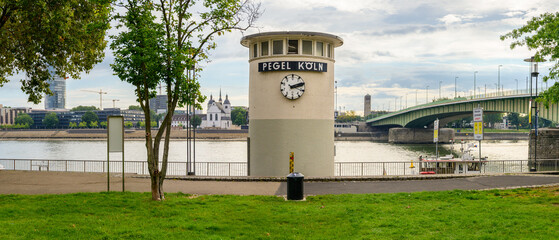 Bright day at Pegel Koln water level gauge tower in Cologne, Germany
