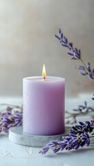 Lavender scented candle on a stone coaster.