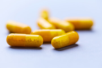 Vitamin C capsules. Bright background. Close up. Copy space.	