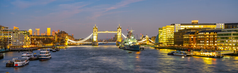 As dusk settles over London, Tower Bridge and HMS Belfast create a stunning skyline along the...
