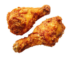 Two crispy fried chicken drumsticks golden brown delicious on transparent background